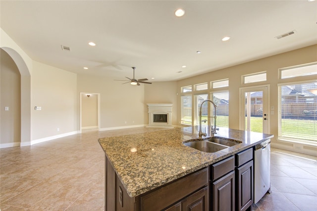 kitchen featuring a healthy amount of sunlight, visible vents, ceiling fan, a sink, and stainless steel dishwasher