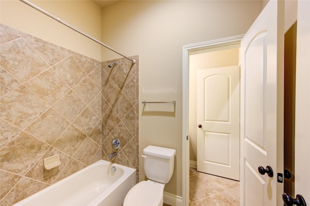 full bath with tile patterned floors, toilet, and shower / tub combination