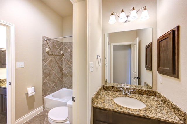 full bath with baseboards, washtub / shower combination, toilet, tile patterned floors, and vanity