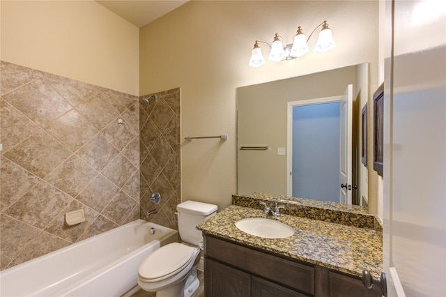 bathroom featuring toilet, bathtub / shower combination, and vanity