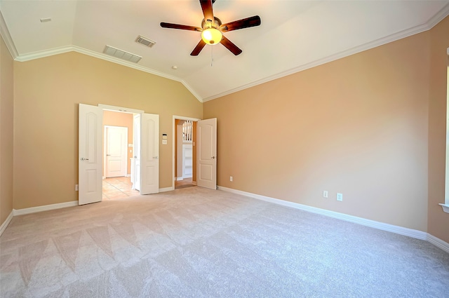 unfurnished bedroom featuring lofted ceiling, crown molding, visible vents, and baseboards