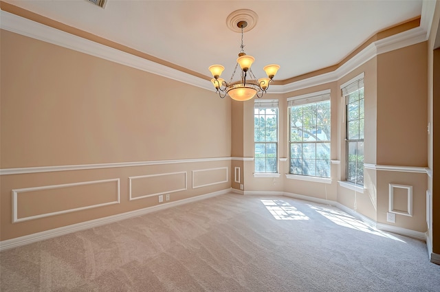 empty room featuring an inviting chandelier, carpet, and ornamental molding