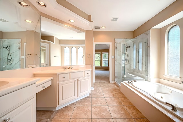 bathroom with vanity, a tub with jets, visible vents, a shower stall, and tile patterned floors