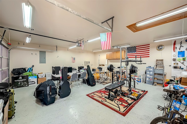 garage with electric panel and a garage door opener