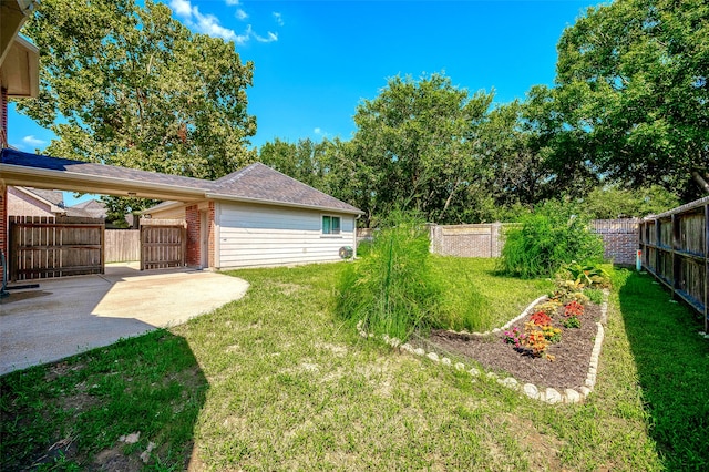 view of yard featuring a patio area and a fenced backyard