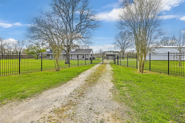 view of road with a gated entry, driveway, and a gate