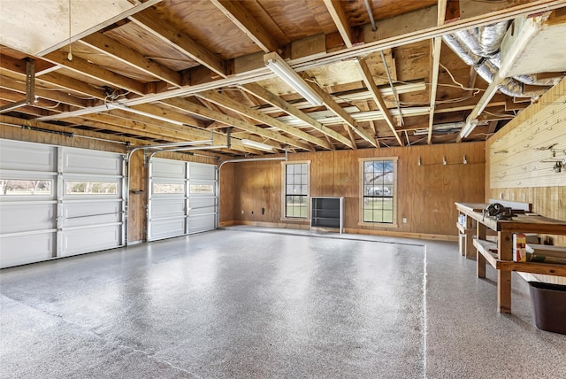 garage featuring wooden walls