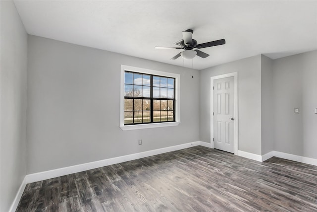 unfurnished bedroom with ceiling fan, baseboards, and dark wood-style flooring