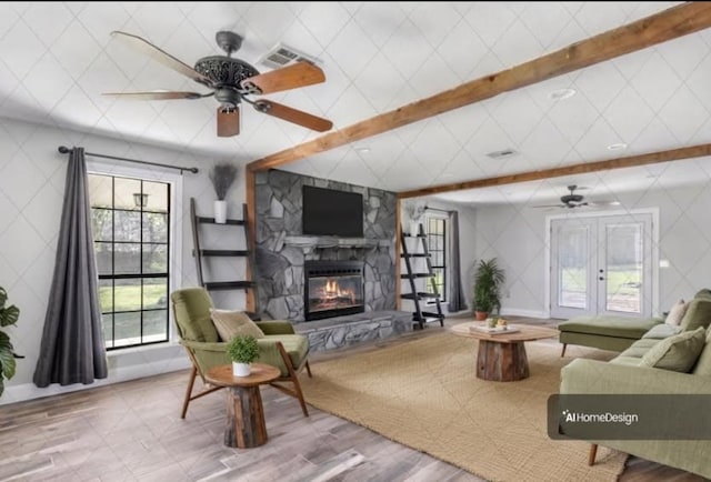 living room with beam ceiling, visible vents, a fireplace, and ceiling fan