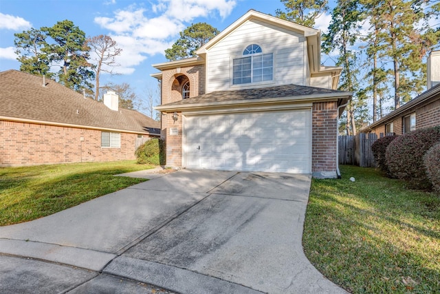 view of front of home with brick siding, a front lawn, fence, driveway, and an attached garage