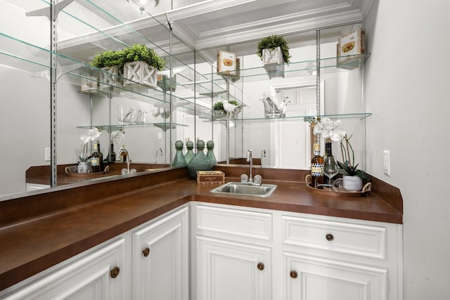 bar with indoor wet bar and a sink