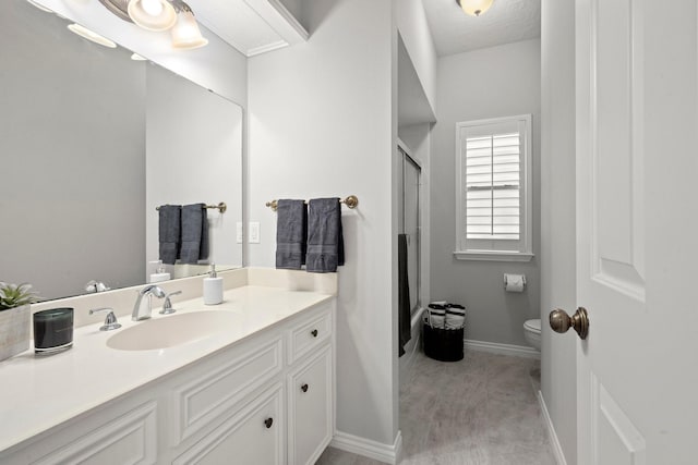 full bath with an enclosed shower, baseboards, toilet, and vanity