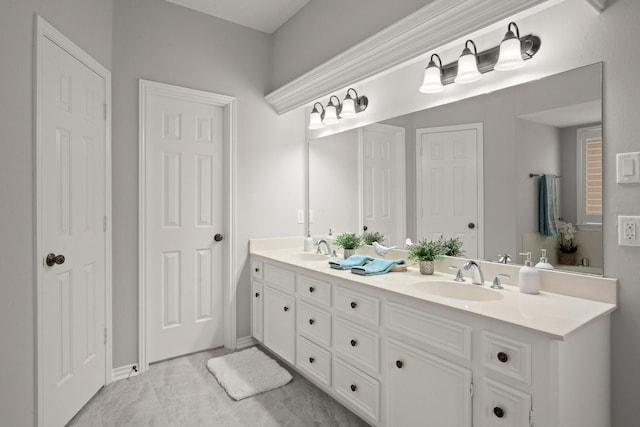 full bath with double vanity and a sink