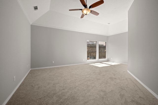 unfurnished room with visible vents, crown molding, baseboards, carpet flooring, and a ceiling fan