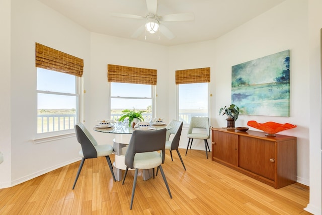 4010 Kiva Rd, Galveston, TX 77554 - dining space with light wood-type flooring, a ceiling fan, and baseboards