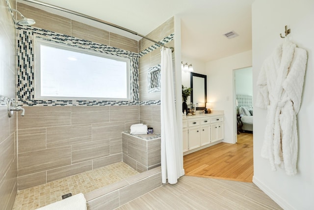 4010 Kiva Rd, Galveston, TX 77554 - full bath with tiled shower, connected bathroom, and vanity
