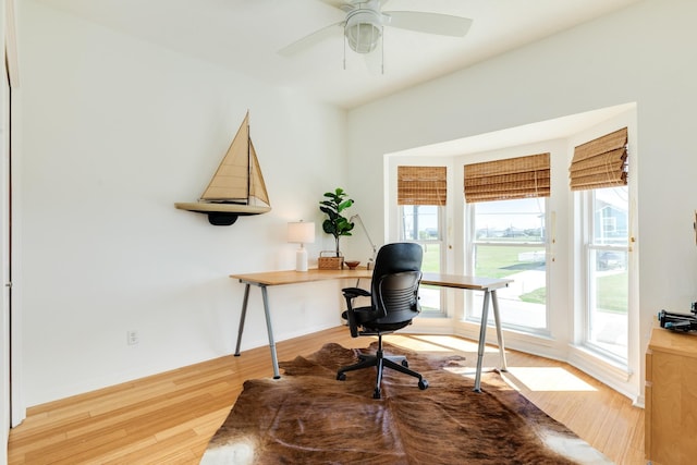 4010 Kiva Rd, Galveston, TX 77554 - office space featuring wood finished floors, a ceiling fan, and baseboards