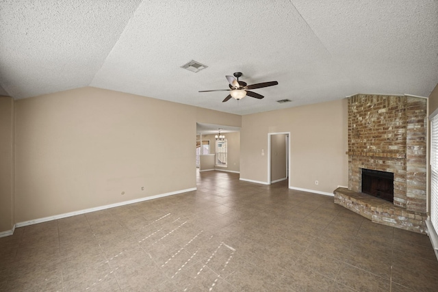 unfurnished living room featuring visible vents, baseboards, ceiling fan, lofted ceiling, and a fireplace