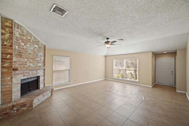 unfurnished living room featuring visible vents, baseboards, a healthy amount of sunlight, and ceiling fan