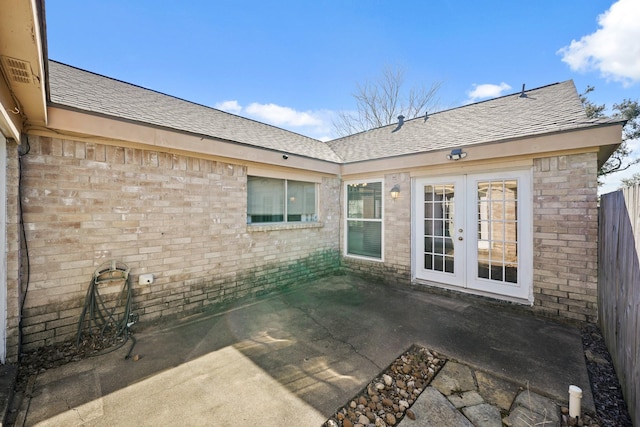 view of patio / terrace featuring french doors and fence