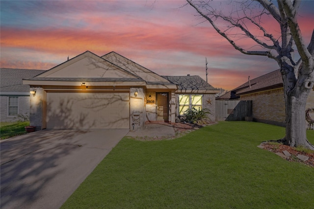 view of front of property with driveway, a front yard, and a garage