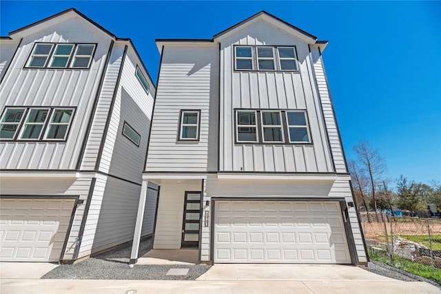 view of front of property featuring a garage, board and batten siding, and driveway