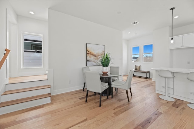 dining space with visible vents, baseboards, stairs, recessed lighting, and light wood-style flooring