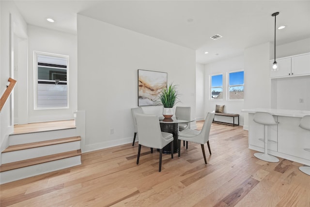 424 Sikes Unit C, Houston, TX 77018 - dining room with light wood-type flooring, stairs, recessed lighting, and baseboards