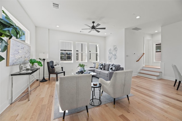 living room with light wood-style flooring, recessed lighting, a ceiling fan, and visible vents