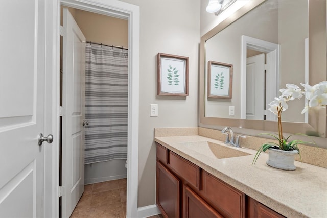 bathroom with tile patterned floors and vanity