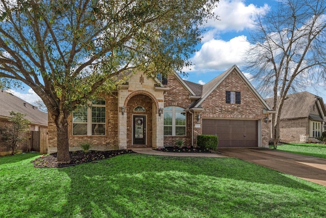 traditional home with concrete driveway, brick siding, and a front yard