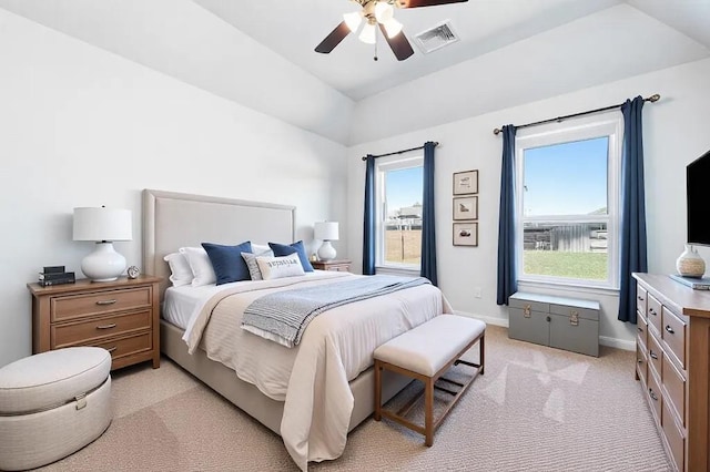 bedroom with light carpet, visible vents, multiple windows, and baseboards