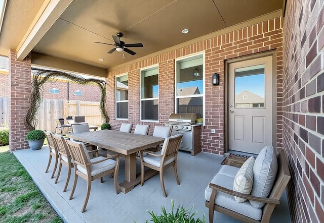 view of patio / terrace with outdoor dining space, area for grilling, fence, and ceiling fan