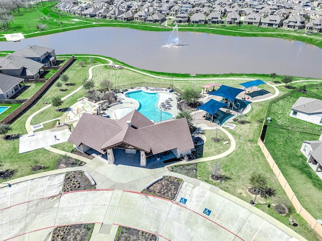 drone / aerial view with a residential view and a water view