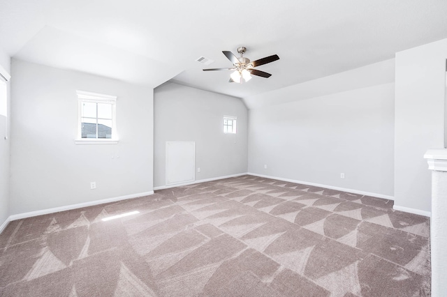 spare room featuring visible vents, baseboards, carpet, and a ceiling fan