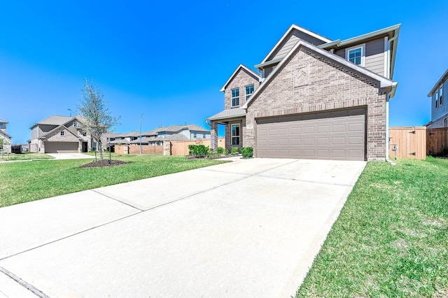 view of front of home with driveway, a residential view, a front yard, a garage, and brick siding