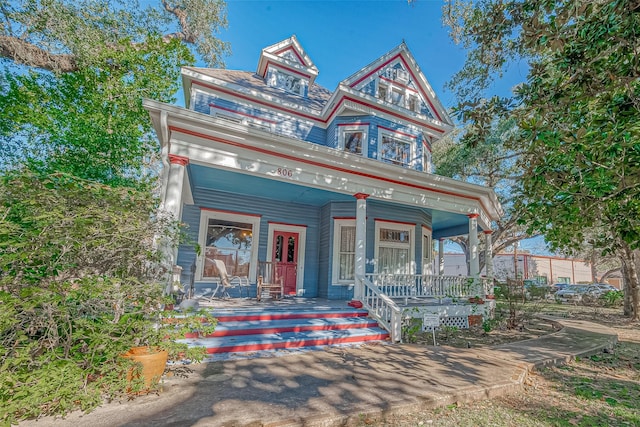 victorian-style house featuring a porch