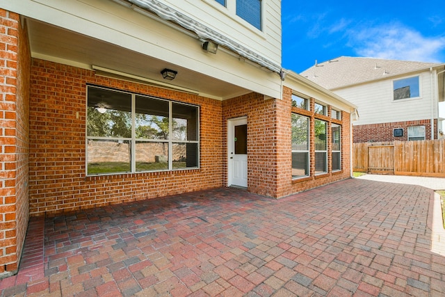 view of patio featuring fence