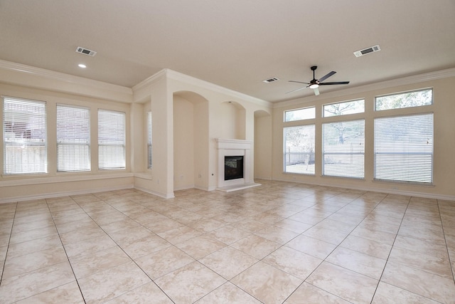 unfurnished living room featuring light tile patterned floors, a ceiling fan, visible vents, and ornamental molding