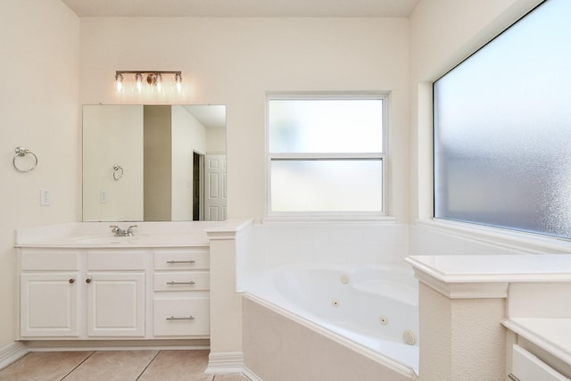 full bathroom featuring vanity, tile patterned floors, and a whirlpool tub