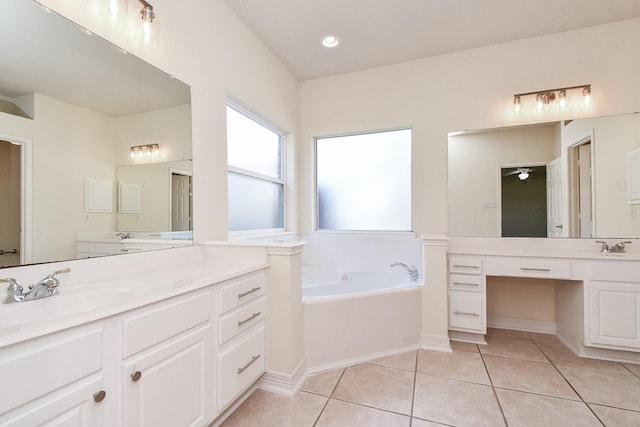 full bathroom with a garden tub, two vanities, a sink, tile patterned flooring, and ceiling fan