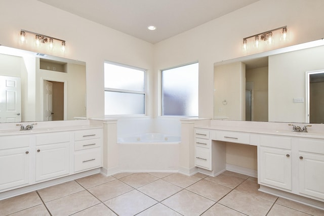 bathroom featuring a sink, two vanities, and tile patterned flooring