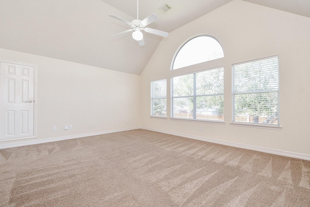 spare room with light carpet, visible vents, high vaulted ceiling, and ceiling fan