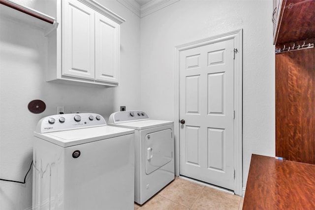 12610 Blanco Terrace Ln, Houston, TX 77041 - laundry area featuring cabinet space, washer and clothes dryer, light tile patterned flooring, and ornamental molding