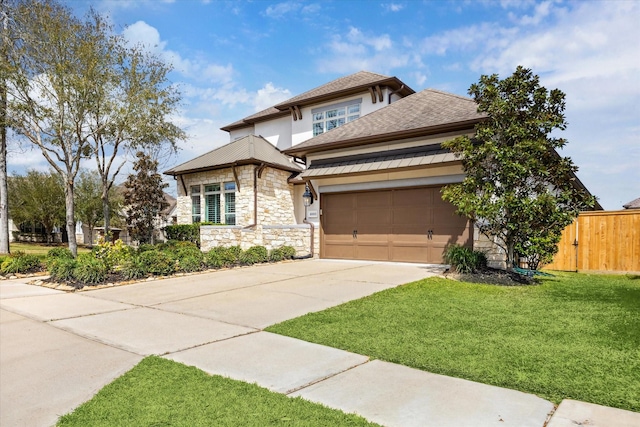 view of front of property with fence, a front yard, a garage, stone siding, and driveway