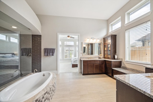 ensuite bathroom with a garden tub, ensuite bath, tiled shower, ceiling fan, and vanity