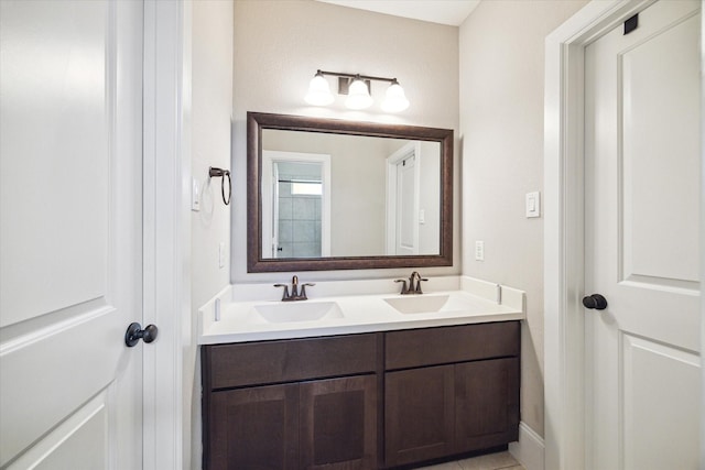 bathroom featuring double vanity and a sink