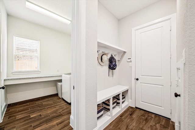 mudroom featuring baseboards and wood finish floors