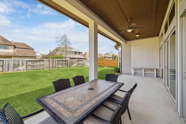 view of patio / terrace with a ceiling fan, outdoor dining area, and a fenced backyard