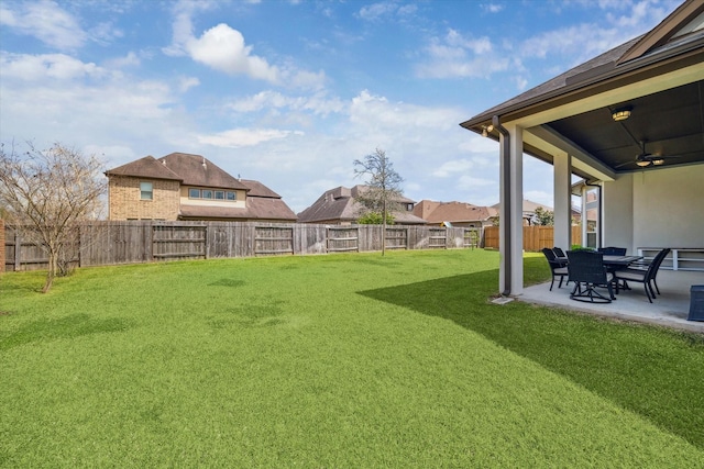 view of yard featuring a patio, a fenced backyard, and a ceiling fan